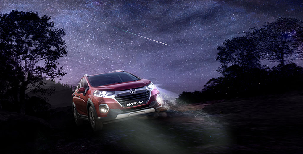 New Red Colour Honda WRV Car on Dusty Road During Night Time
