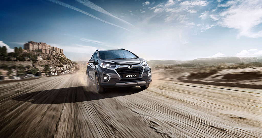 Meteoroid Grey Metallic Colour Honda WRV Car on Dusty Road