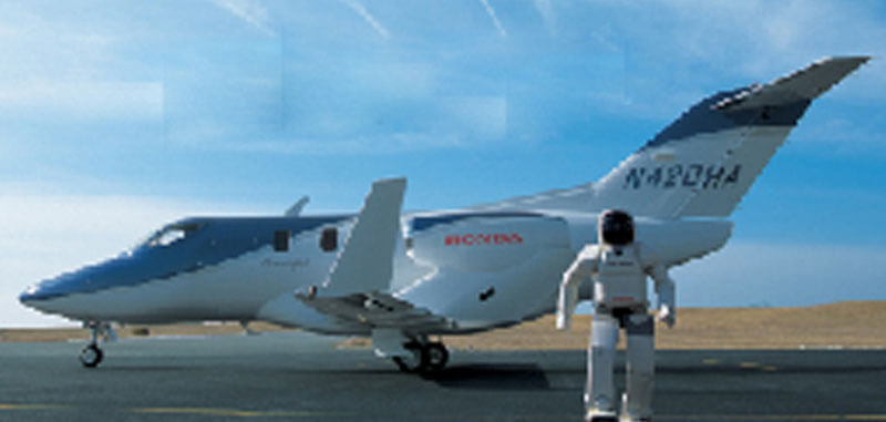 Front View of Asimo Robot Standing with Hondajet